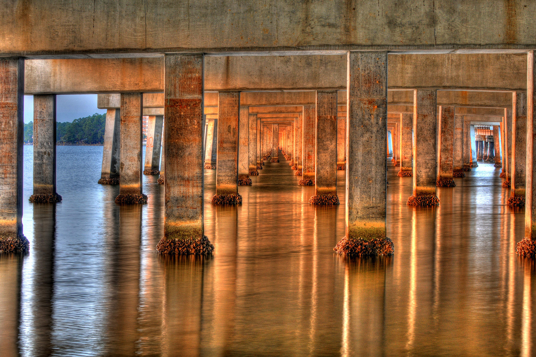 Under a dock with serene waters flowing through